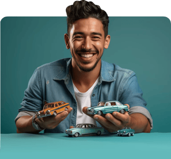 Hombre feliz con carros en las manos